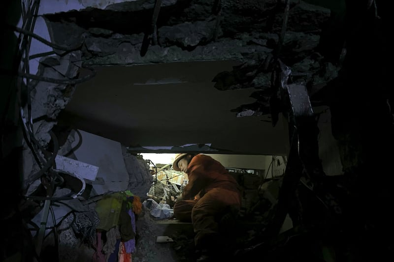 A rescuer worker at a collapsed building in Naypyidaw, March 28, 2025, following an earthquake in central Myanmar.