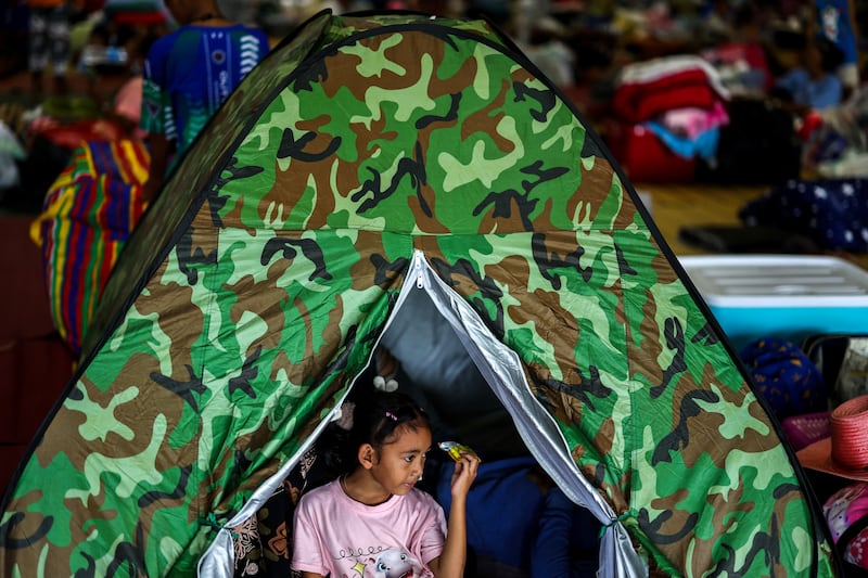 Wanmai, 6, rests inside a shelter in Surin after Thailand and Cambodia exchanged heavy artillery, July 25, 2025.