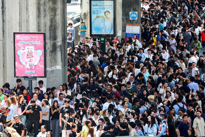 People in Bangkok gather on the street after a strong earthquake struck central Myanmar, March 28, 2025.