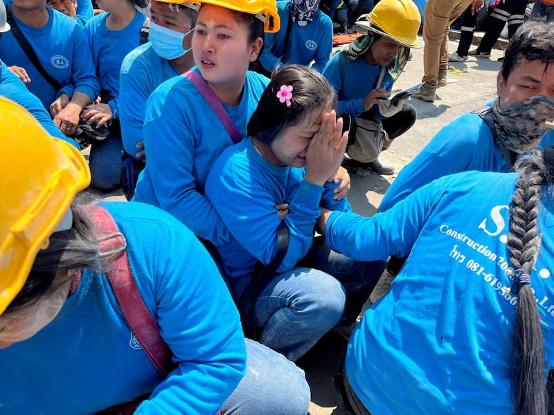 A worker in Bangkok reacts near a site of a collapsed building after the earthquake in neighboring Myanmar, March 28, 2025.