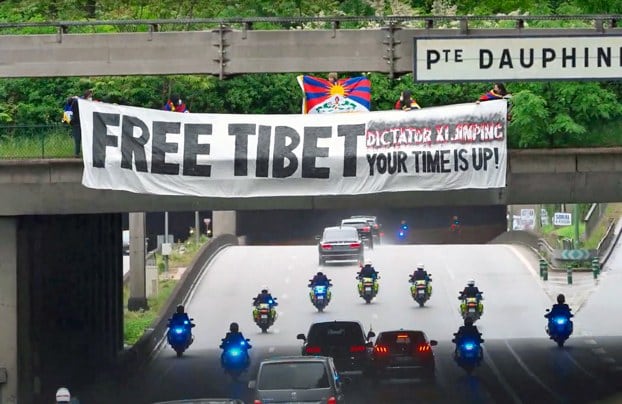 Tibetan, Uyghur protesters greet Xi Jinping in Paris