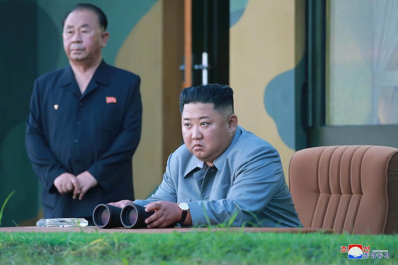 North Korean leader Kim Jong Un watches the test-firing of missiles in an undated picture released on July 26, 2019.