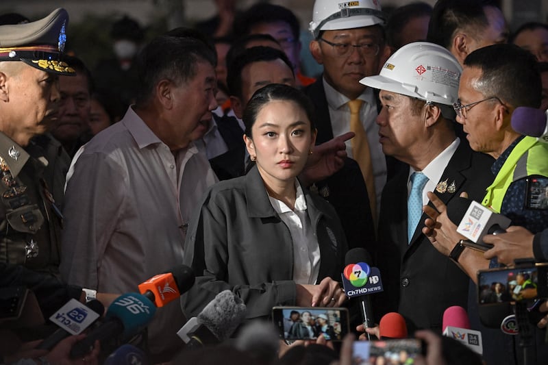 Thailand's Prime Minister Paetongtarn Shinawatra arrives at a construction site where a building collapsed in Bangkok on March 28, 2025, after an earthquake in Myanmar.