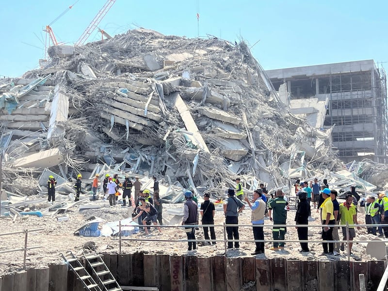 Rescuers work at the site of a collapsed building after the tremors of a strong earthquake that struck central Myanmar on Friday affected Bangkok, Thailand, March 28, 2025.