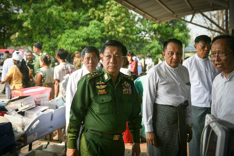 Myanmar's military chief Min Aung Hlaing arrives to meet earthquake survivors gathered at a hospital in Naypyidaw on March 28, 2025, after an earthquake in central Myanmar.