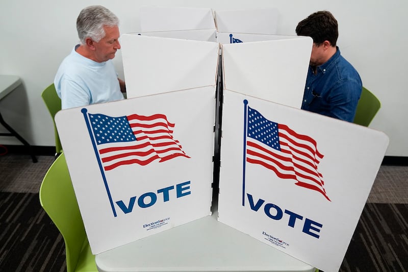 People vote at Tysons-Pimmit Regional Library in Falls Church, Virginia, Oct. 31, 2024.